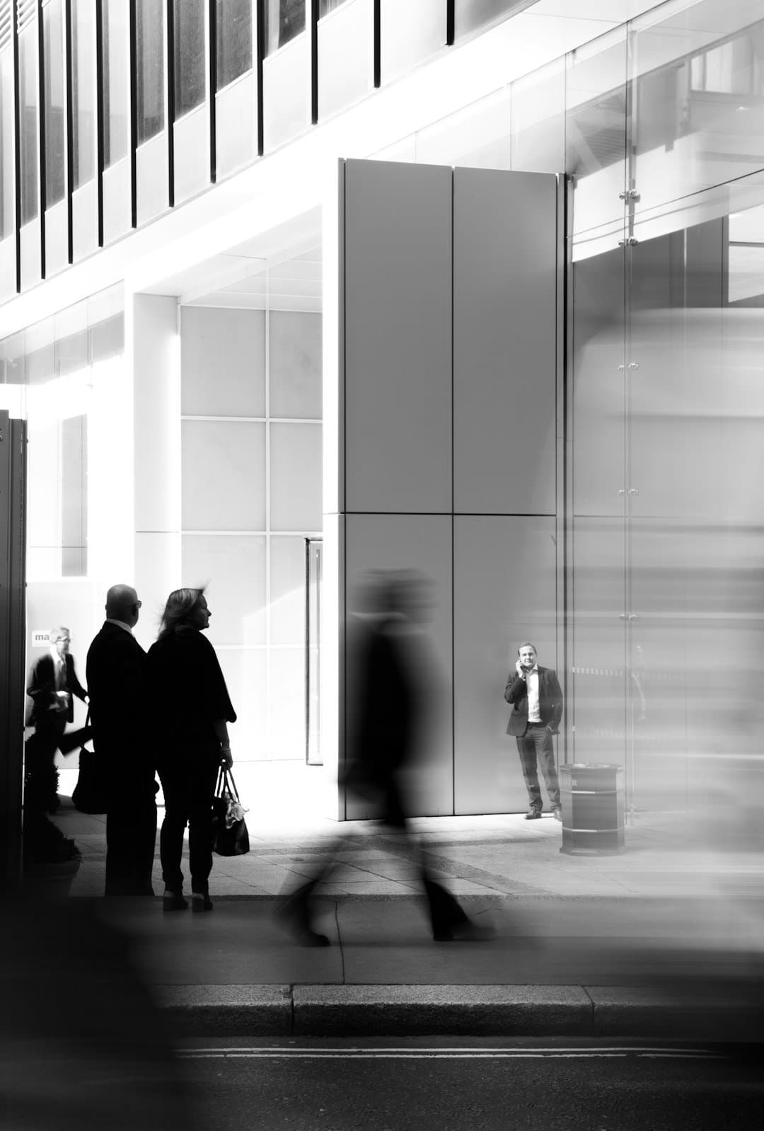 Office view with silhouettes of people looking at city skyline